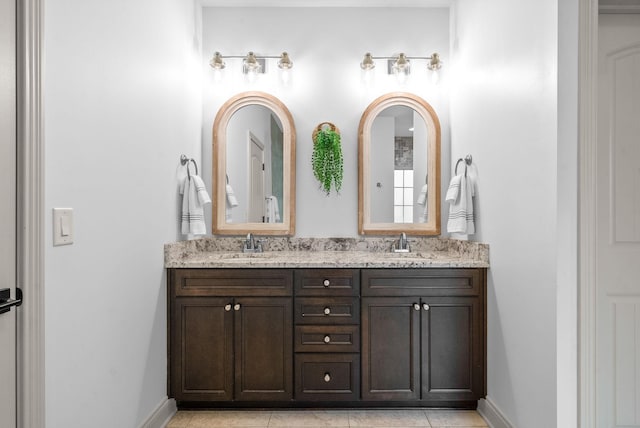 127 Copperstone Dr, Clarksville, TN 37043 - full bathroom featuring double vanity, baseboards, and tile patterned flooring