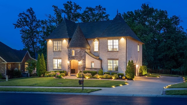 127 Copperstone Dr, Clarksville, TN 37043 - view of front facade with a lawn, brick siding, and driveway