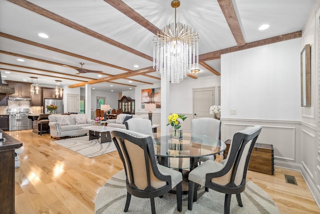 127 Copperstone Dr, Clarksville, TN 37043 - dining area with beam ceiling, a chandelier, light wood-style flooring, recessed lighting, and a decorative wall
