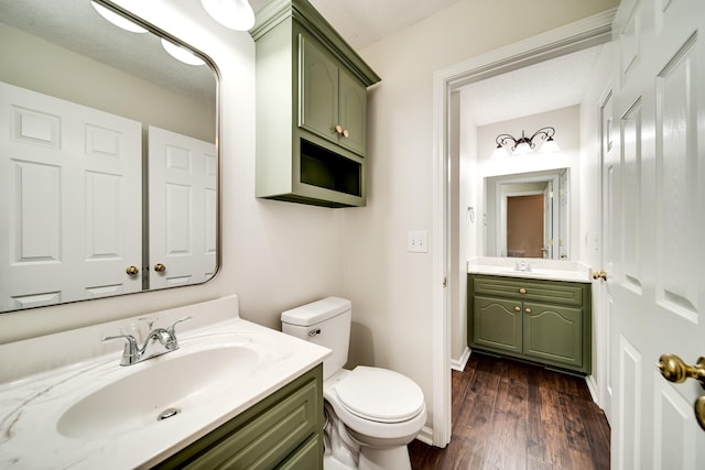 3889 Mackenzie Dr, Clarksville, TN 37042 - bathroom with vanity, wood finished floors, and toilet