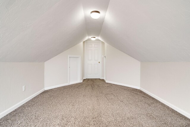 3889 Mackenzie Dr, Clarksville, TN 37042 - bonus room with vaulted ceiling, carpet flooring, and baseboards