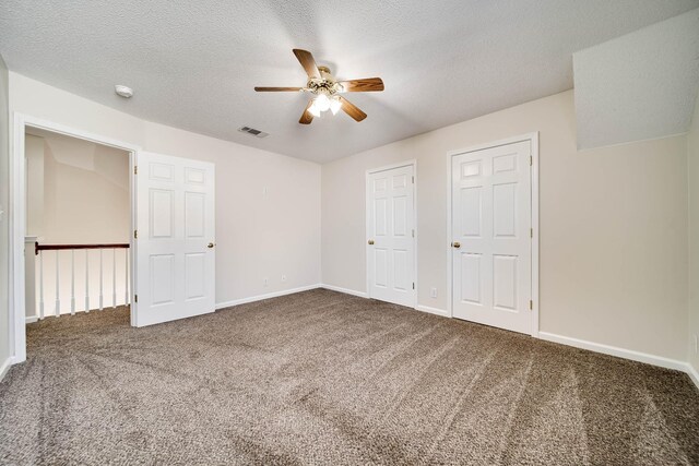 3889 Mackenzie Dr, Clarksville, TN 37042 - unfurnished bedroom featuring carpet flooring, baseboards, a ceiling fan, and a textured ceiling