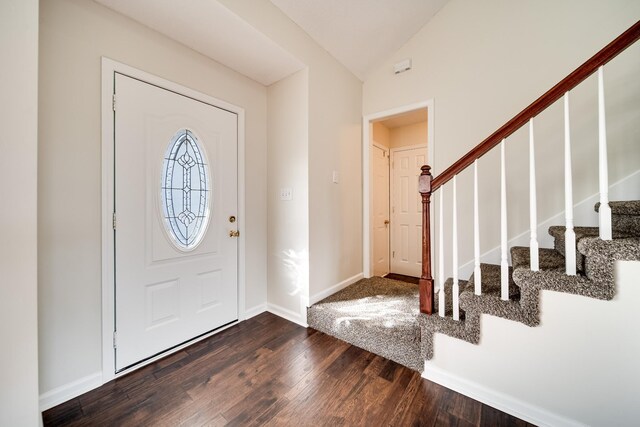3889 Mackenzie Dr, Clarksville, TN 37042 - entrance foyer featuring dark wood-type flooring, stairs, baseboards, and vaulted ceiling