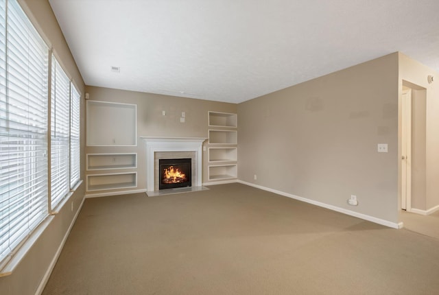 905 Arbor Springs Dr, Mount Juliet, TN 37122 - unfurnished living room featuring baseboards, built in features, and carpet floors