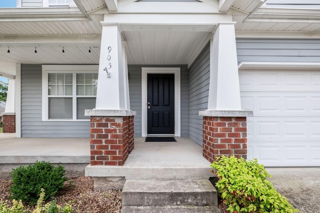 905 Arbor Springs Dr, Mount Juliet, TN 37122 - entrance to property with covered porch, brick siding, and a garage