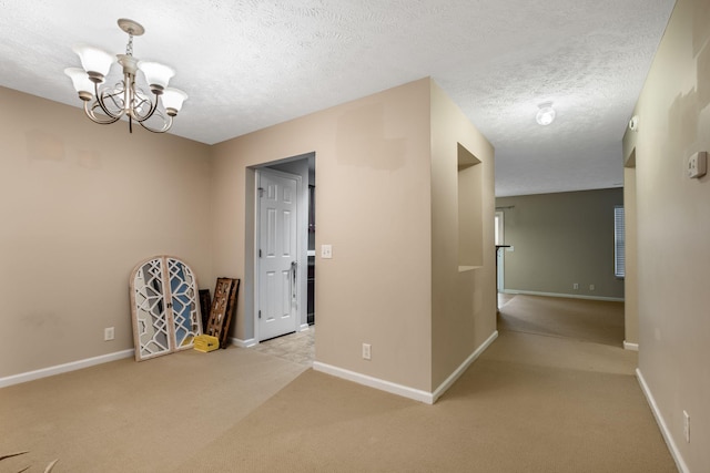 905 Arbor Springs Dr, Mount Juliet, TN 37122 - spare room with a chandelier, carpet floors, baseboards, and a textured ceiling