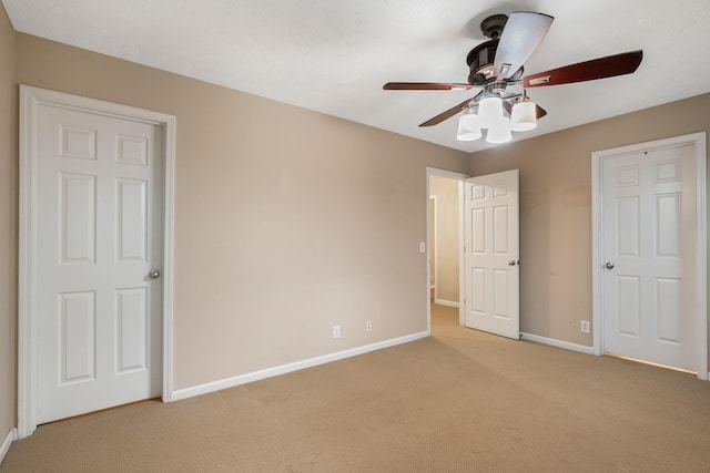 905 Arbor Springs Dr, Mount Juliet, TN 37122 - unfurnished bedroom featuring light carpet, baseboards, and a ceiling fan