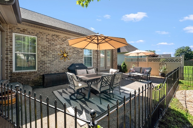 390 Buckingham Blvd, Gallatin, TN 37066 - fenced backyard with an outdoor hangout area, a patio area, and area for grilling