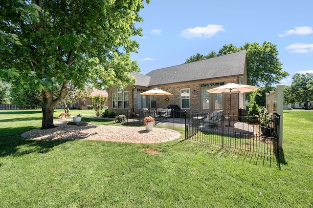 390 Buckingham Blvd, Gallatin, TN 37066 - rear view of house with a patio area, brick siding, and a shingled roof