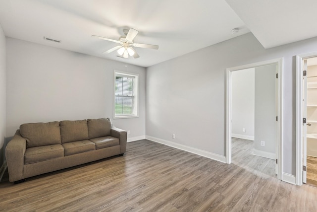 974 Bonellis Ln, Clarksville, TN 37040 - living room featuring a ceiling fan, wood finished floors, and baseboards