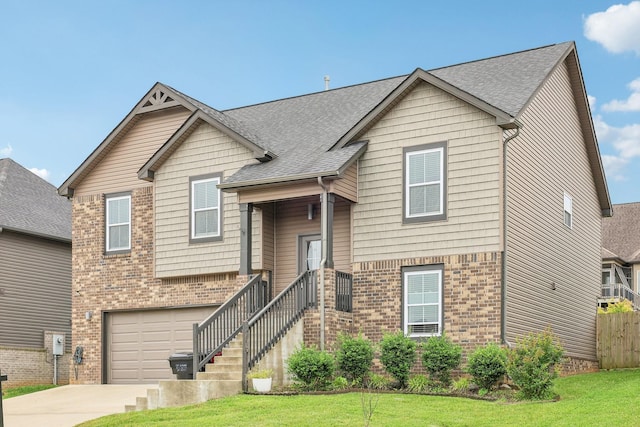 974 Bonellis Ln, Clarksville, TN 37040 - view of front of home featuring brick siding, concrete driveway, an attached garage, and roof with shingles
