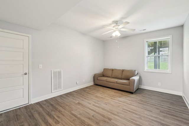 974 Bonellis Ln, Clarksville, TN 37040 - living area with wood finished floors, a ceiling fan, and baseboards