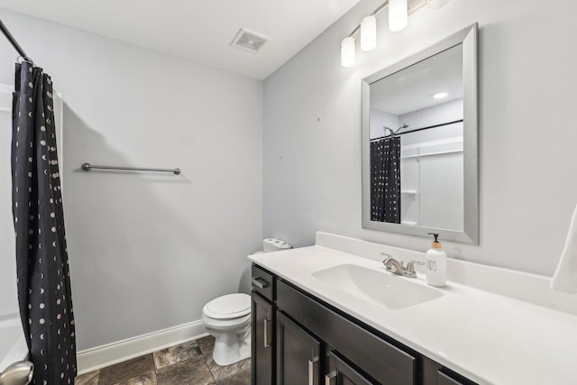 974 Bonellis Ln, Clarksville, TN 37040 - full bath with vanity, toilet, baseboards, curtained shower, and stone finish flooring