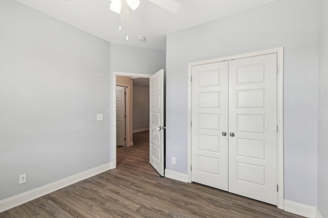 974 Bonellis Ln, Clarksville, TN 37040 - unfurnished bedroom with baseboards, a closet, dark wood-style floors, and a ceiling fan