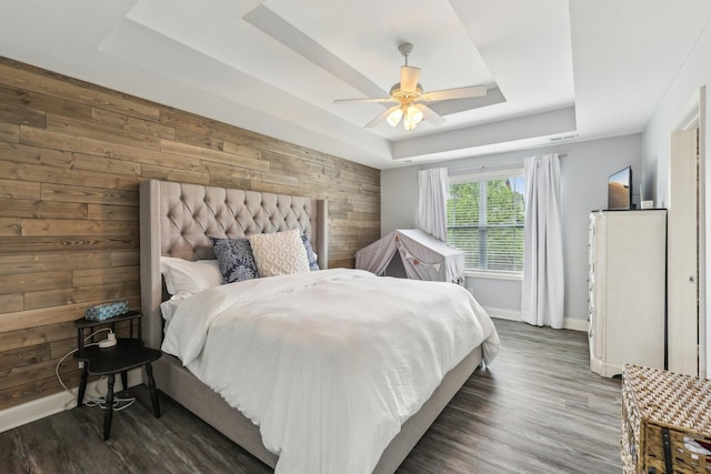 974 Bonellis Ln, Clarksville, TN 37040 - bedroom with a raised ceiling, wooden walls, baseboards, wood finished floors, and ceiling fan