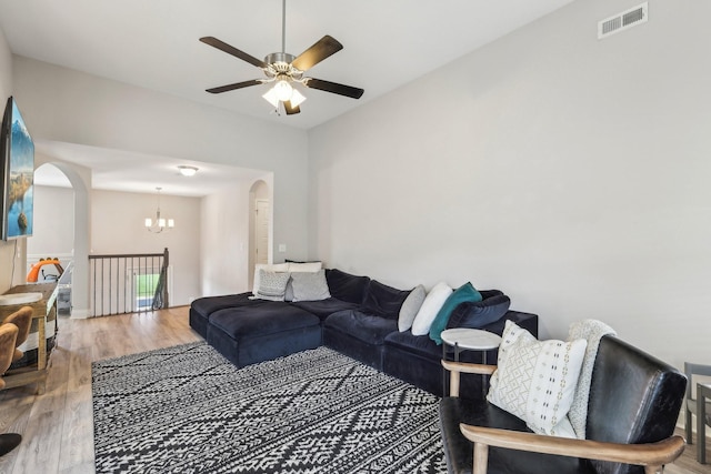974 Bonellis Ln, Clarksville, TN 37040 - living room with arched walkways, ceiling fan, wood finished floors, and a chandelier