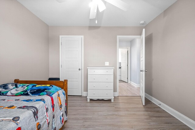 974 Bonellis Ln, Clarksville, TN 37040 - bedroom with wood finished floors, baseboards, and a ceiling fan