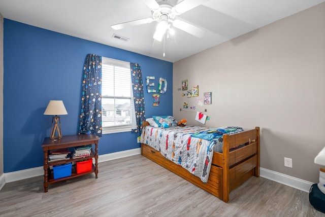 974 Bonellis Ln, Clarksville, TN 37040 - bedroom featuring wood finished floors, baseboards, and a ceiling fan