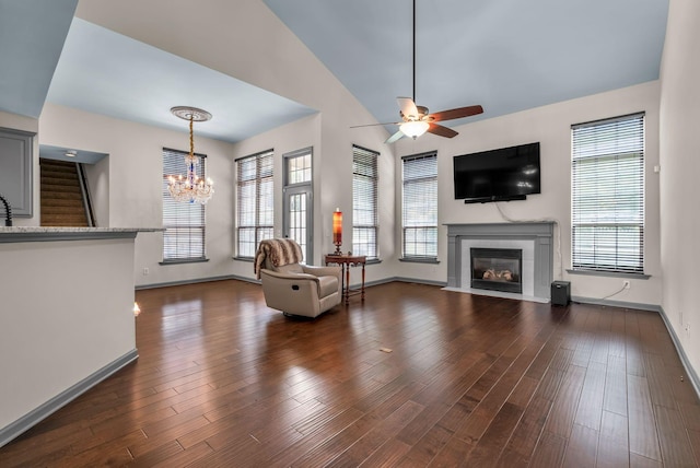 6948 Stone Run Dr, Nashville, TN 37211 - living room with a ceiling fan, a tile fireplace, a chandelier, and baseboards
