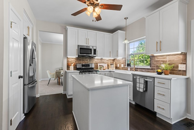 3224 Nolen Ln, Franklin, TN 37064 - kitchen with stainless steel appliances, a sink, ceiling fan, white cabinetry, and dark wood finished floors