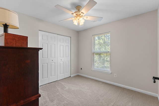 3224 Nolen Ln, Franklin, TN 37064 - unfurnished bedroom with light colored carpet, baseboards, a closet, and a ceiling fan