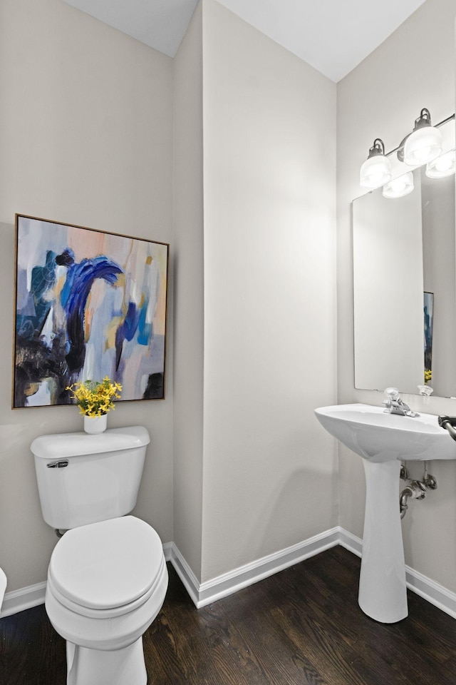 3224 Nolen Ln, Franklin, TN 37064 - bathroom with toilet, baseboards, and wood finished floors