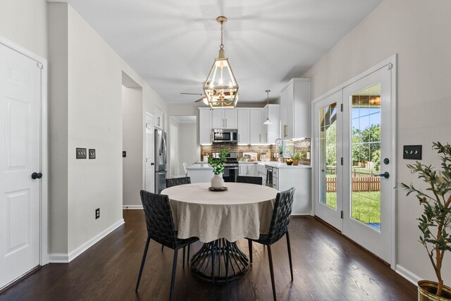 3224 Nolen Ln, Franklin, TN 37064 - dining space featuring plenty of natural light, dark wood-style flooring, baseboards, and a chandelier