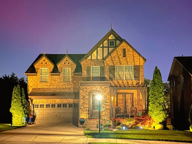 102 Cobbler Cir, Hendersonville, TN 37075 - view of front of property with concrete driveway, an attached garage, french doors, stone siding, and a porch