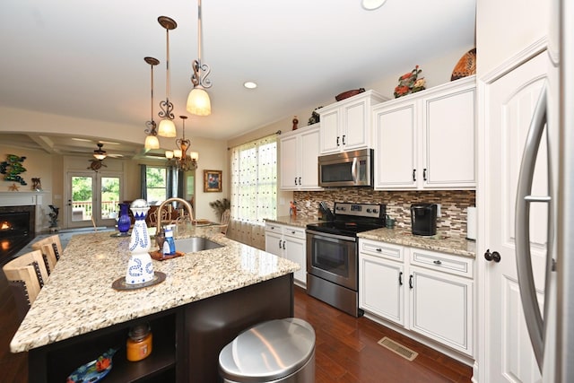 102 Cobbler Cir, Hendersonville, TN 37075 - kitchen featuring stainless steel appliances, a sink, a ceiling fan, white cabinetry, and recessed lighting