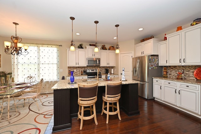 102 Cobbler Cir, Hendersonville, TN 37075 - kitchen featuring stainless steel appliances, white cabinets, decorative backsplash, a chandelier, and recessed lighting