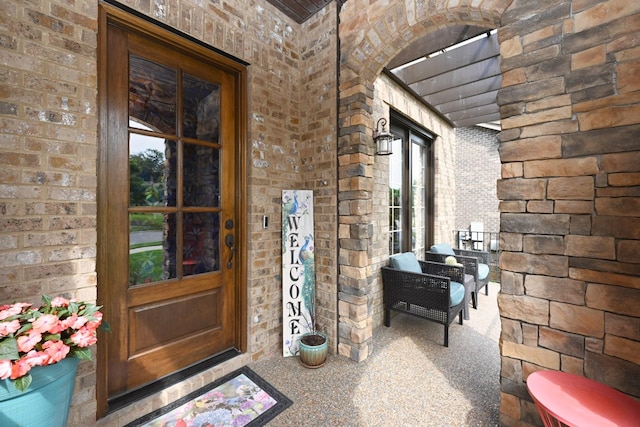102 Cobbler Cir, Hendersonville, TN 37075 - view of exterior entry with brick siding, covered porch, and stone siding