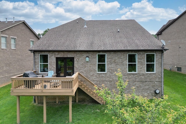 102 Cobbler Cir, Hendersonville, TN 37075 - rear view of property featuring roof with shingles, a lawn, a wooden deck, brick siding, and stairway