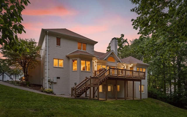 414 Gentlemens Rdg, Signal Mountain, TN 37377 - back of property at dusk featuring stairway, a chimney, a wooden deck, and brick siding