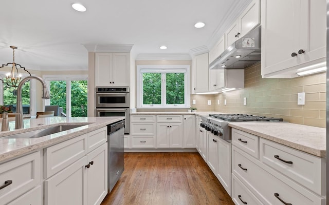 414 Gentlemens Rdg, Signal Mountain, TN 37377 - kitchen featuring under cabinet range hood, a sink, stainless steel appliances, crown molding, and white cabinets