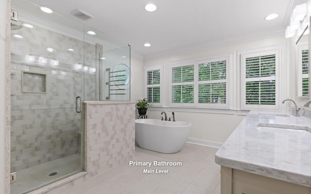 414 Gentlemens Rdg, Signal Mountain, TN 37377 - bathroom with double vanity, a shower stall, crown molding, a freestanding bath, and tile patterned flooring