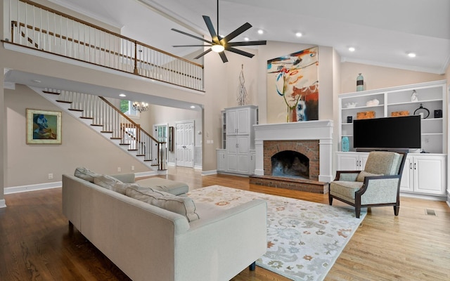 414 Gentlemens Rdg, Signal Mountain, TN 37377 - living area with stairs, ceiling fan, wood finished floors, baseboards, and high vaulted ceiling