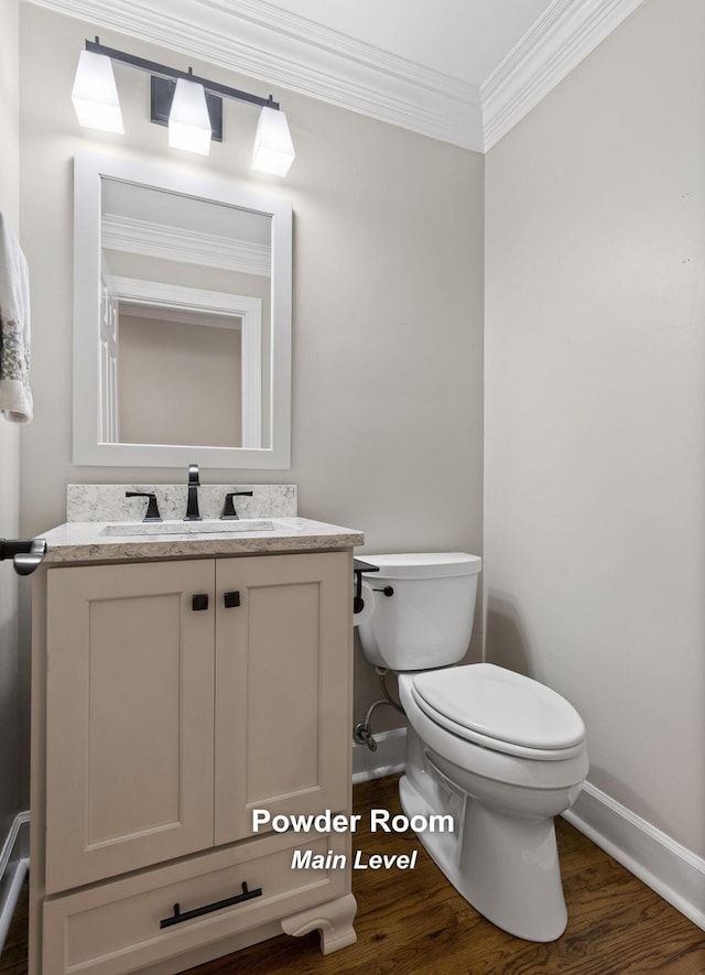 414 Gentlemens Rdg, Signal Mountain, TN 37377 - bathroom with baseboards, toilet, vanity, wood finished floors, and crown molding