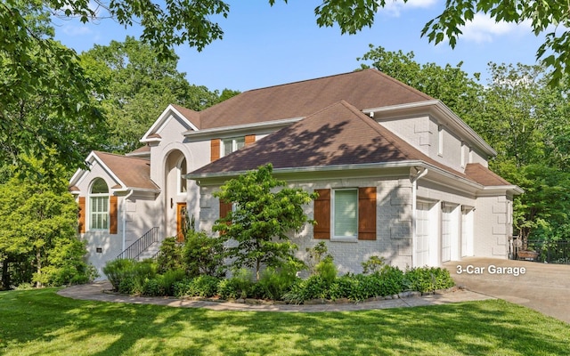 414 Gentlemens Rdg, Signal Mountain, TN 37377 - view of front of property with brick siding, concrete driveway, a front lawn, and an attached garage