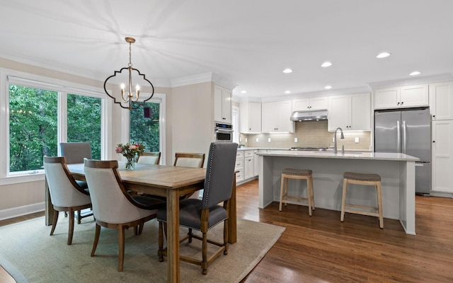414 Gentlemens Rdg, Signal Mountain, TN 37377 - dining space featuring a chandelier, ornamental molding, recessed lighting, dark wood-style flooring, and baseboards