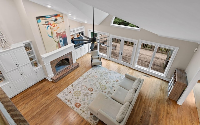 414 Gentlemens Rdg, Signal Mountain, TN 37377 - living room with lofted ceiling, a fireplace, light wood-style floors, and recessed lighting