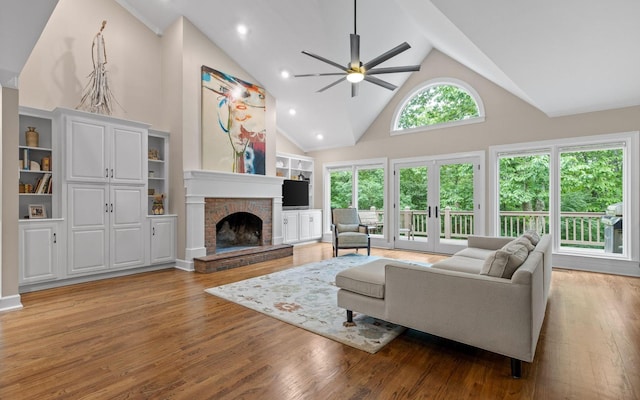 414 Gentlemens Rdg, Signal Mountain, TN 37377 - living room with high vaulted ceiling, ceiling fan, a brick fireplace, light wood-style floors, and recessed lighting