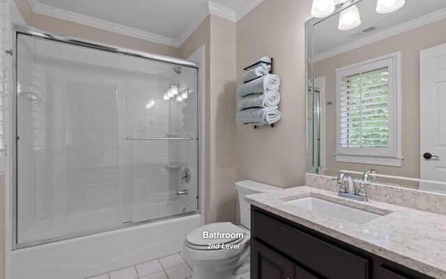 414 Gentlemens Rdg, Signal Mountain, TN 37377 - full bathroom with vanity, toilet, combined bath / shower with glass door, crown molding, and tile patterned flooring