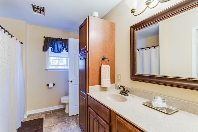 2119 W Lincoln St, Tullahoma, TN 37388 - full bathroom with toilet, vanity, baseboards, stone finish flooring, and curtained shower