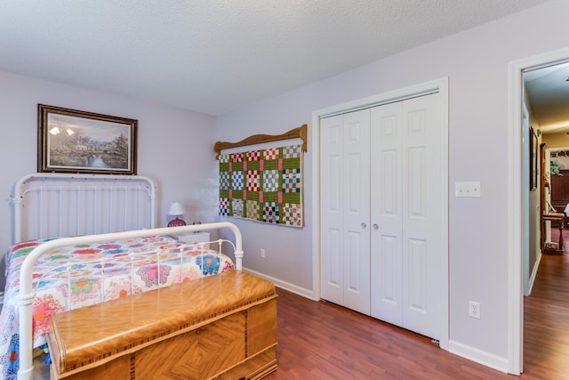 2119 W Lincoln St, Tullahoma, TN 37388 - bedroom with wood finished floors, baseboards, a closet, and a textured ceiling