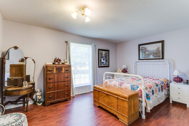2119 W Lincoln St, Tullahoma, TN 37388 - bedroom featuring wood finished floors and a textured ceiling