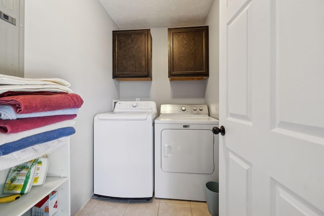 4010 Swift Springs Ct, Goodlettsville, TN 37072 - washroom featuring cabinet space, washer and dryer, a textured ceiling, and light tile patterned floors
