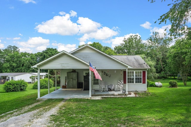 3238 Murphy Ln, Columbia, TN 38401 - view of front of property with dirt driveway, a carport, and a front lawn