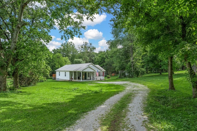 3238 Murphy Ln, Columbia, TN 38401 - view of front of home featuring driveway, a front yard, and a forest view