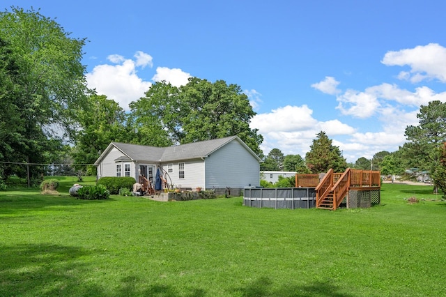 3238 Murphy Ln, Columbia, TN 38401 - view of green lawn with an outdoor pool and a deck