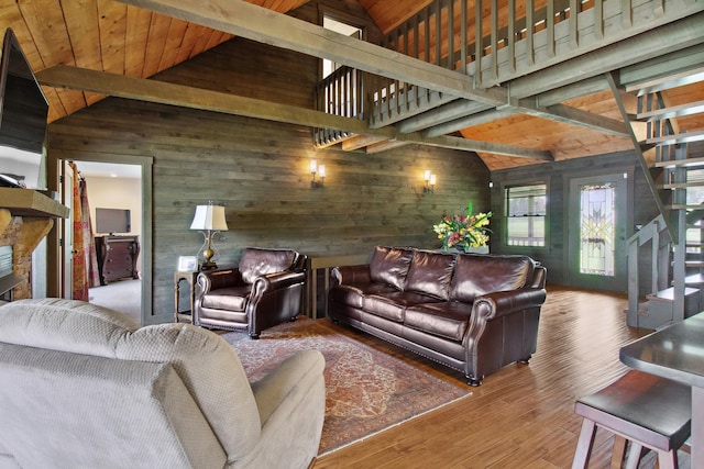 100 Acree Ln, Estill Springs, TN 37330 - living room with wooden walls, wood finished floors, wood ceiling with exposed beams, stairs, and high vaulted ceiling